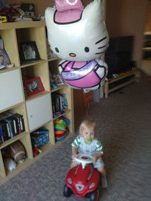 Unser Sohn Maximilian mit seinem gepimpten Bobby-car ;))